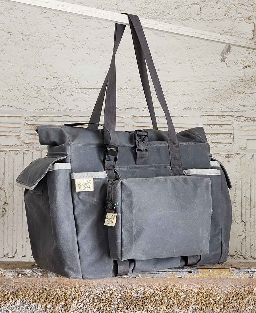 an image of the grey fabric pouch attached to the front of a large tote bag