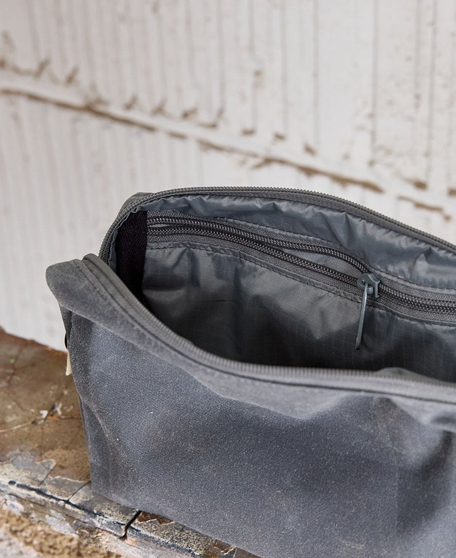 the interior of a grey fabric pouch