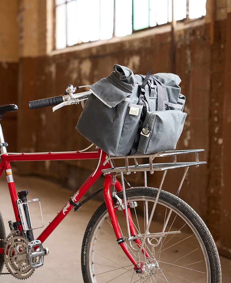 an image of the garner and tow tote bag attached to the front of a bike