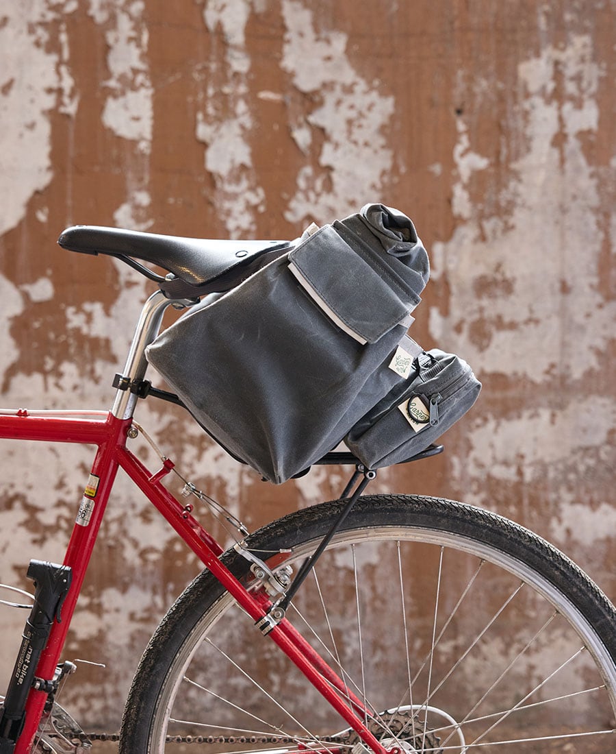 the tote bag attached to the back of a bike
