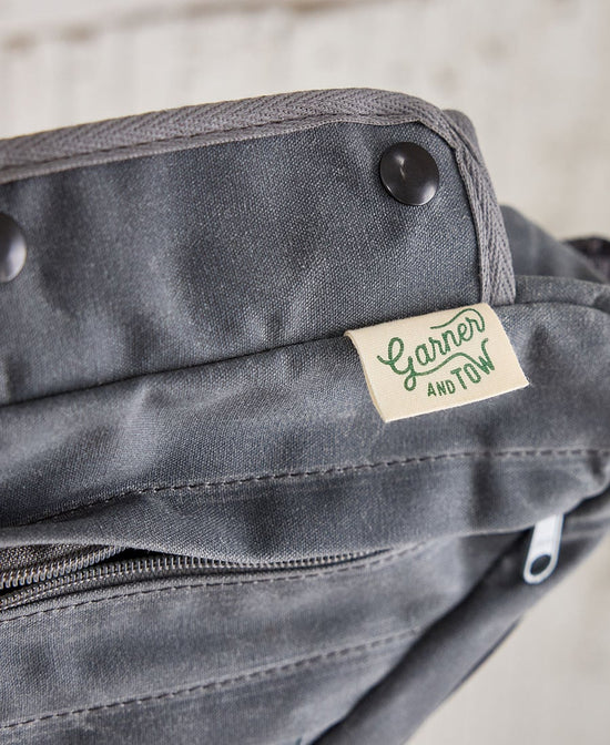 a logo closeup of a gray framebag for garner and tow
